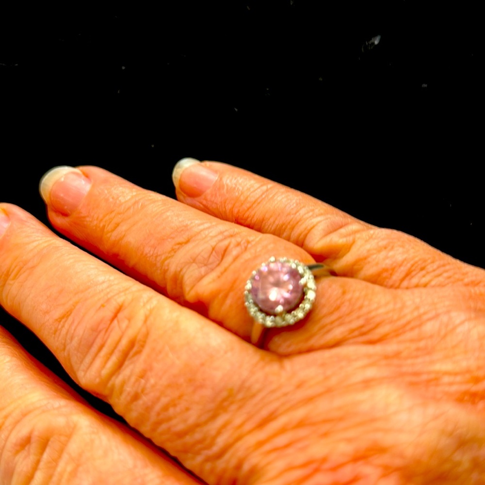 Size 8 sterling silver ring with 5/16th pink center stone.